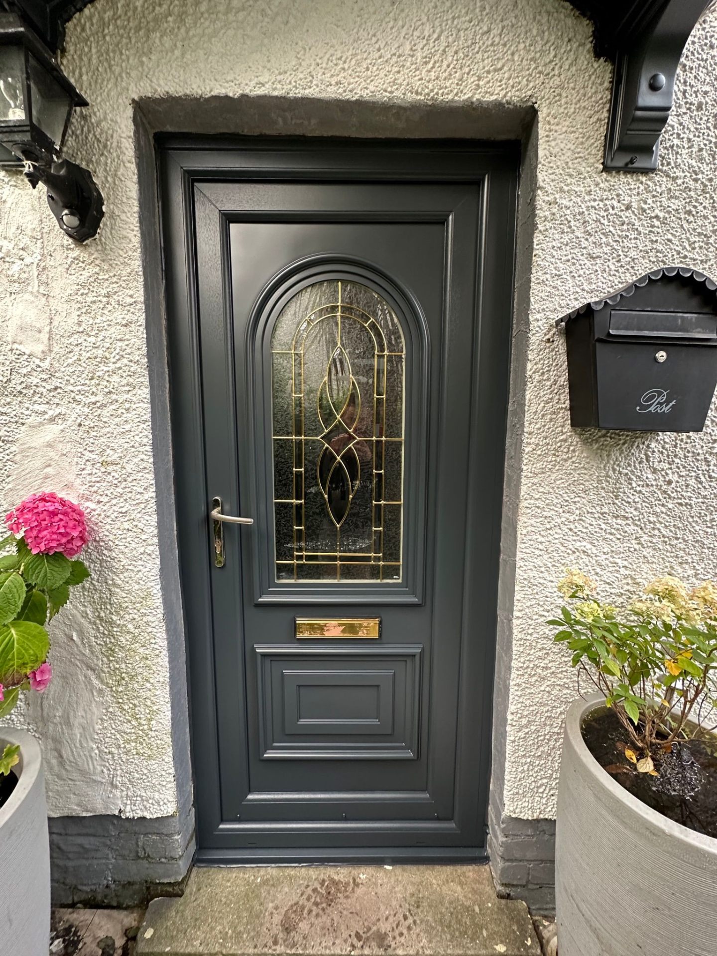 Composite front door respray in anthracite grey on rendered exterior